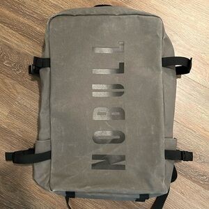 NOBULL Waxed Canvas Duffle Backpack in charcoal gray